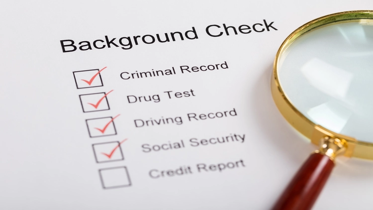 Image showing a background check form with checkboxes for various screening components like criminal record, drug test, driving record, and social security information.