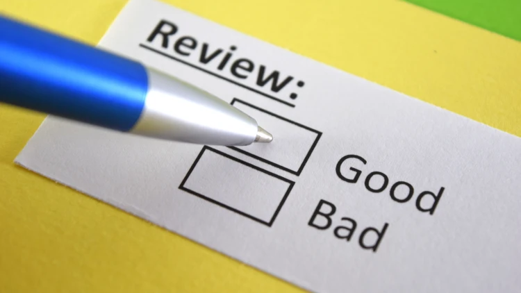 "Image of a piece of paper with a checkbox under the 'Review' header, positioned between 'Good' and 'Bad'.