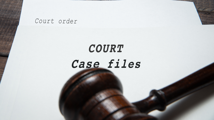 Image of a court order paper titled "COURT Case files" next to a wooden gavel