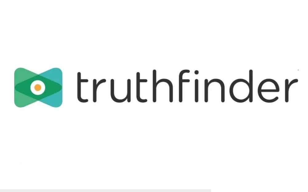 Truthfinder logo screenshot, green arrows overlapping to frame an eye, with the brand name truth finder in lowercase letters. 