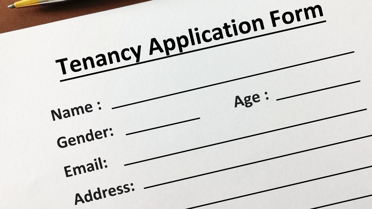 Closeup image of a tenancy application form.