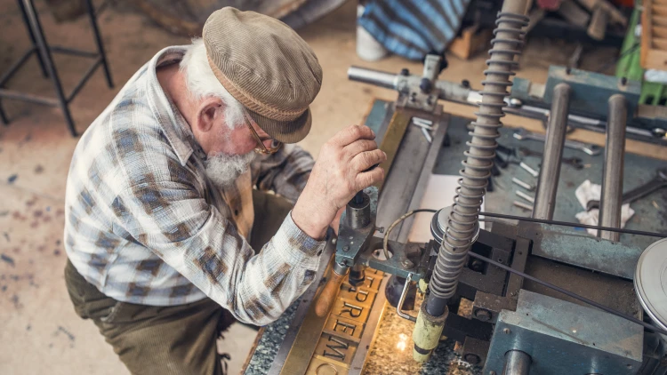 A man working on a machine shop.