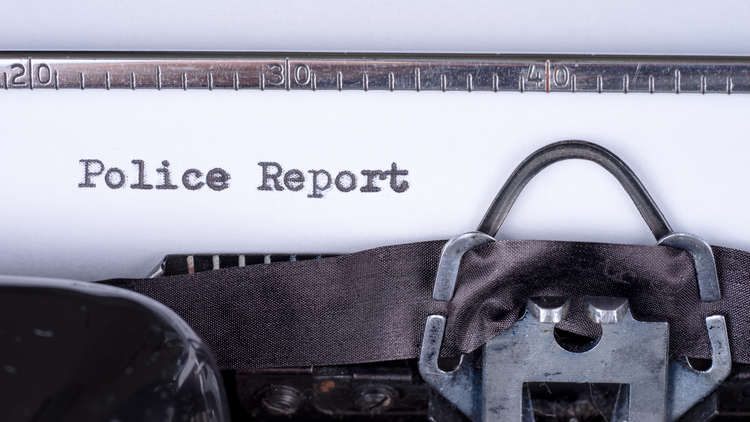 A police report form documentation in a typewriter.