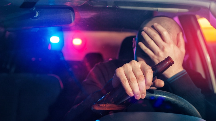 Image of a male driver caught driving under the influence of alcohol.