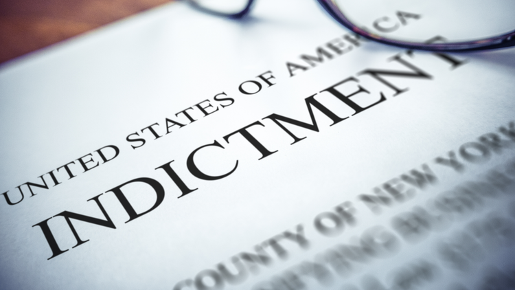 An image showing a close-up view of an indictment document.