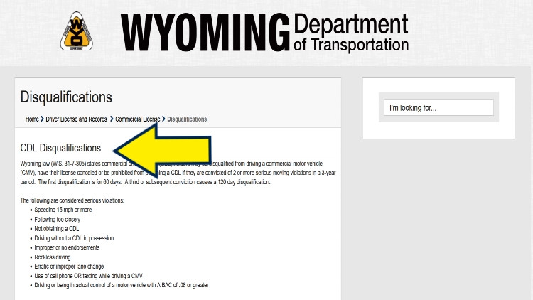 Screenshot of Wyoming Department of Transportation website page about disqualifications with yellow arrow pointing to CDL disqualifications.