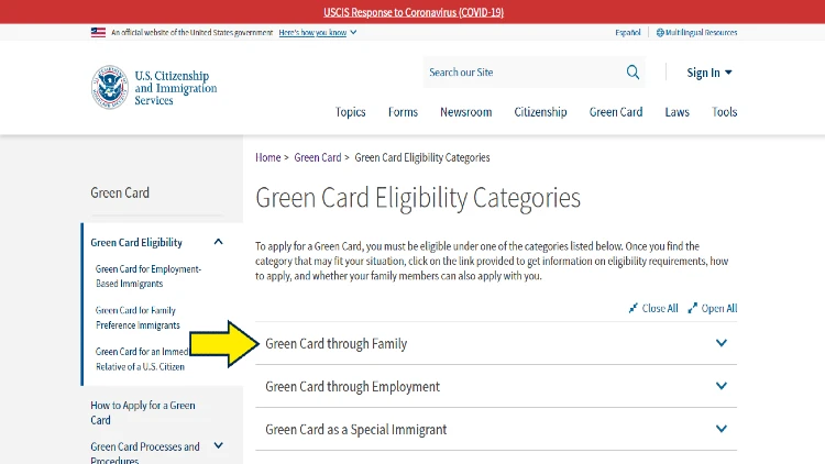 Screenshot of U.S. Department of Homeland Security website page for green card eligibility categories with yellow arrow on green card through family.