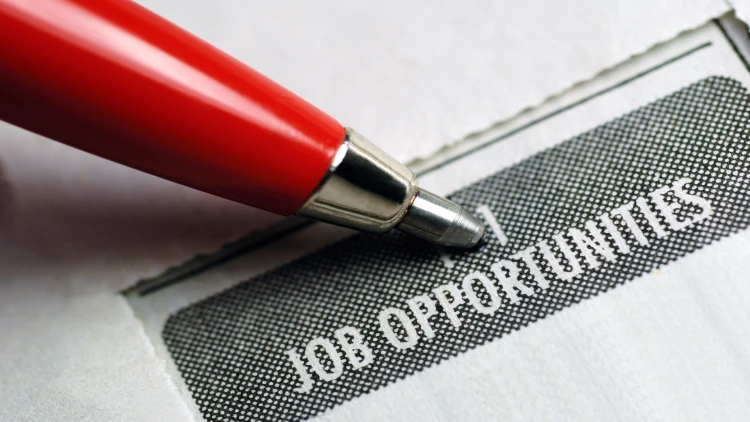 Close up image of job opportunity classified advertising with red pen