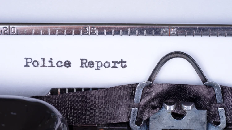 Close up image of Police Report written with a vintage typewriter