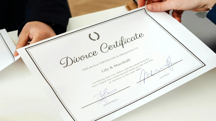 Close up image of divorce certificate and pen