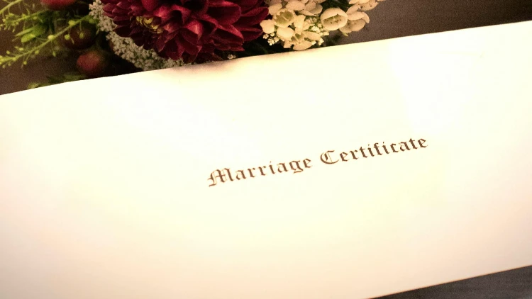 Close up image of marriage certificate written on an envelope