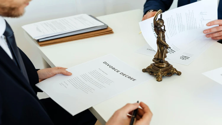 Close up image of signing divorce decree