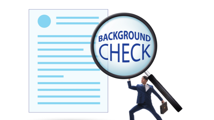A man in a suit holding a huge magnifying glass emphasizing the words background check.