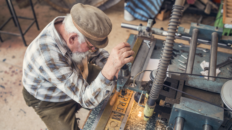 A man working on a machine shop.