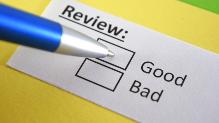 "Image of a piece of paper with a checkbox under the 'Review' header, positioned between 'Good' and 'Bad'.