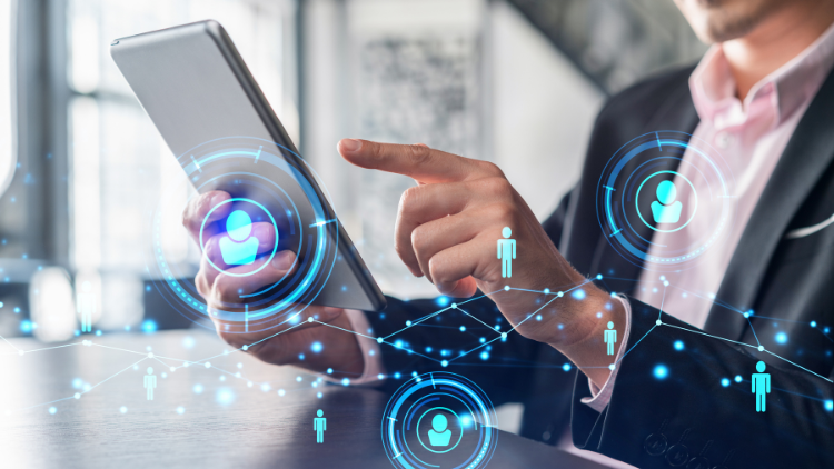 A man in a suit using a tablet to do an international background check online.