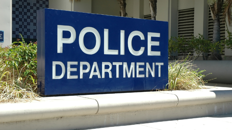 Eye-level view of the signage at the police department.